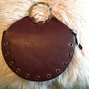 Leather like purse with circle gold tone handles